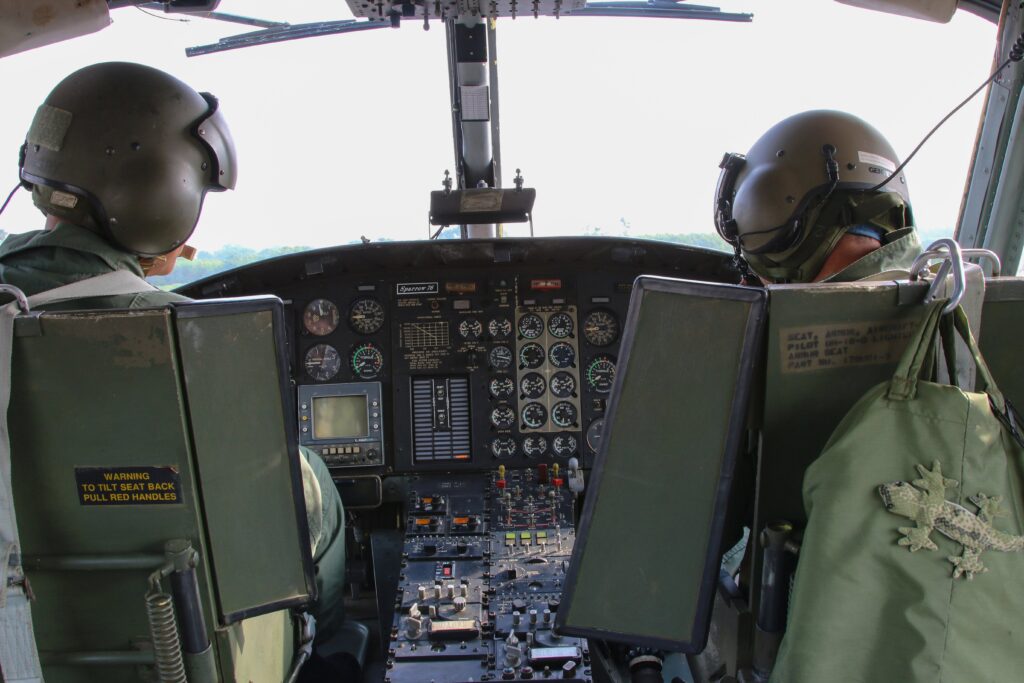 Combat Pilots In Helicopter Cockpit