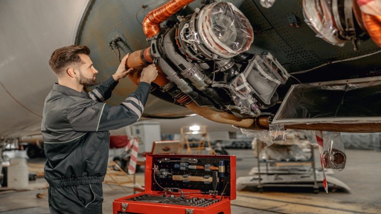 Technician Using Aircraft Tools